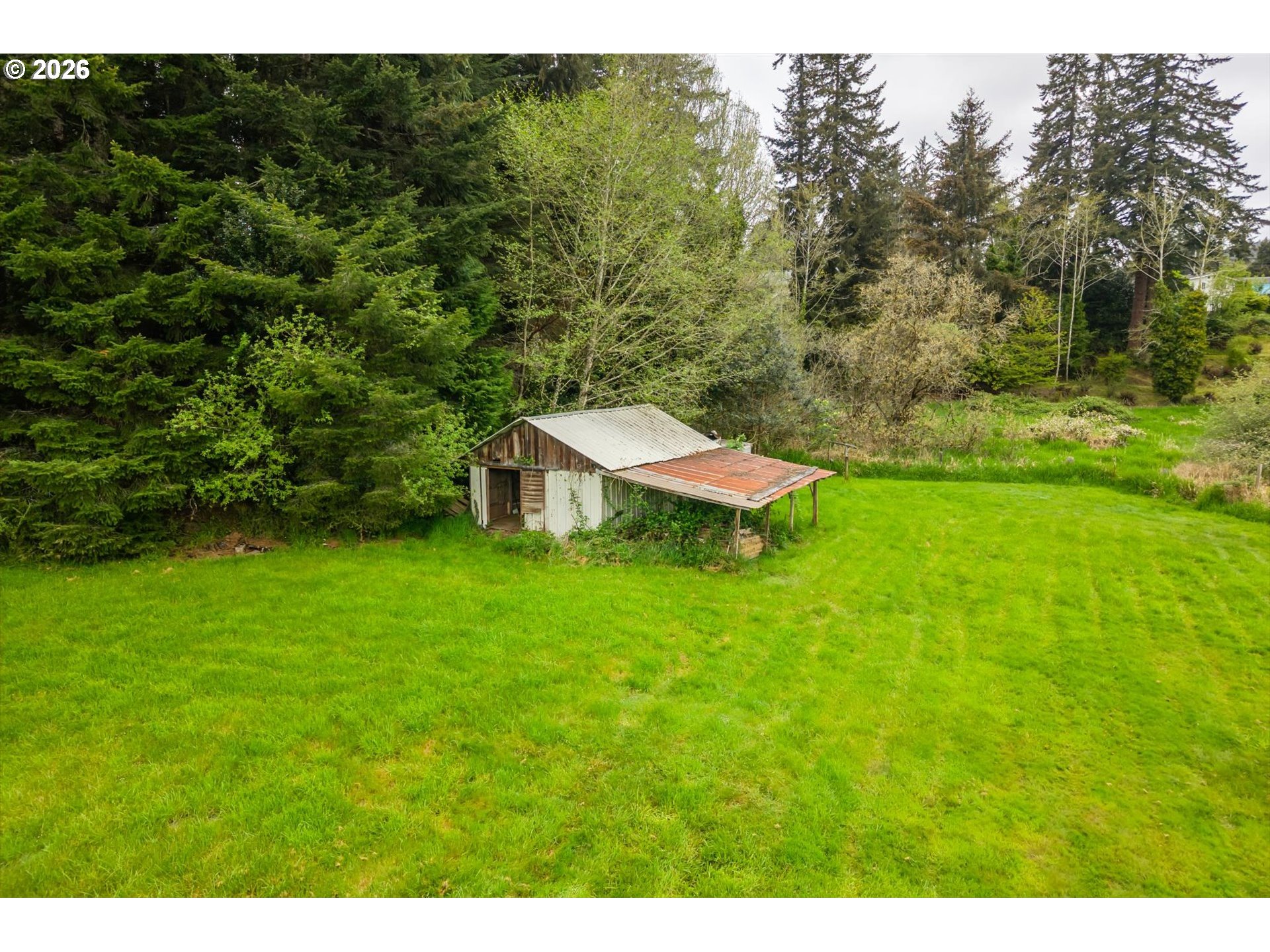63008 Red Dyke Road Coos Bay, OR 97420 - Photo 18 of 18 a view of a backyard with a garden