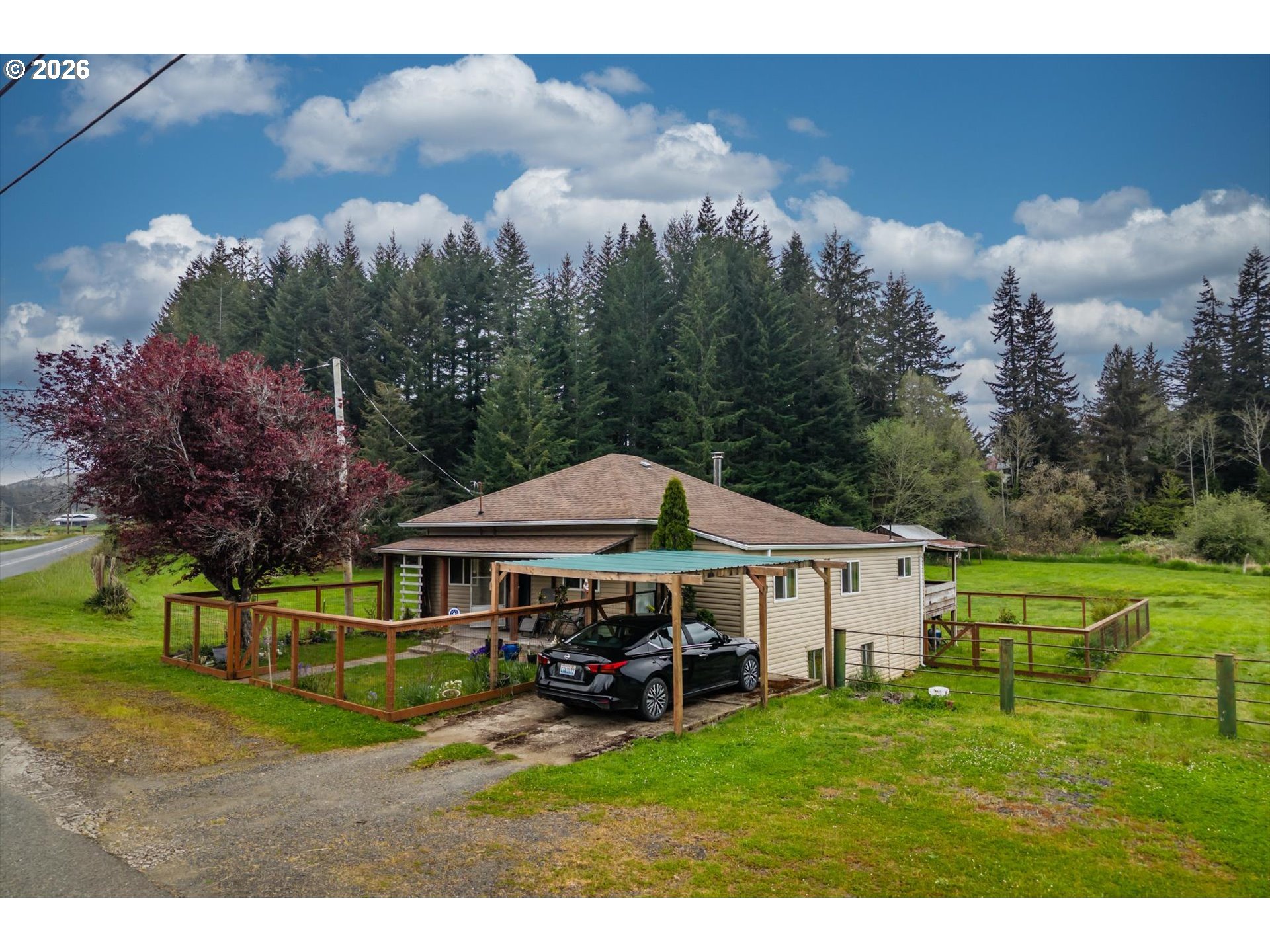63008 Red Dyke Road Coos Bay, OR 97420 - Photo 2 of 18 a view of a house with garden