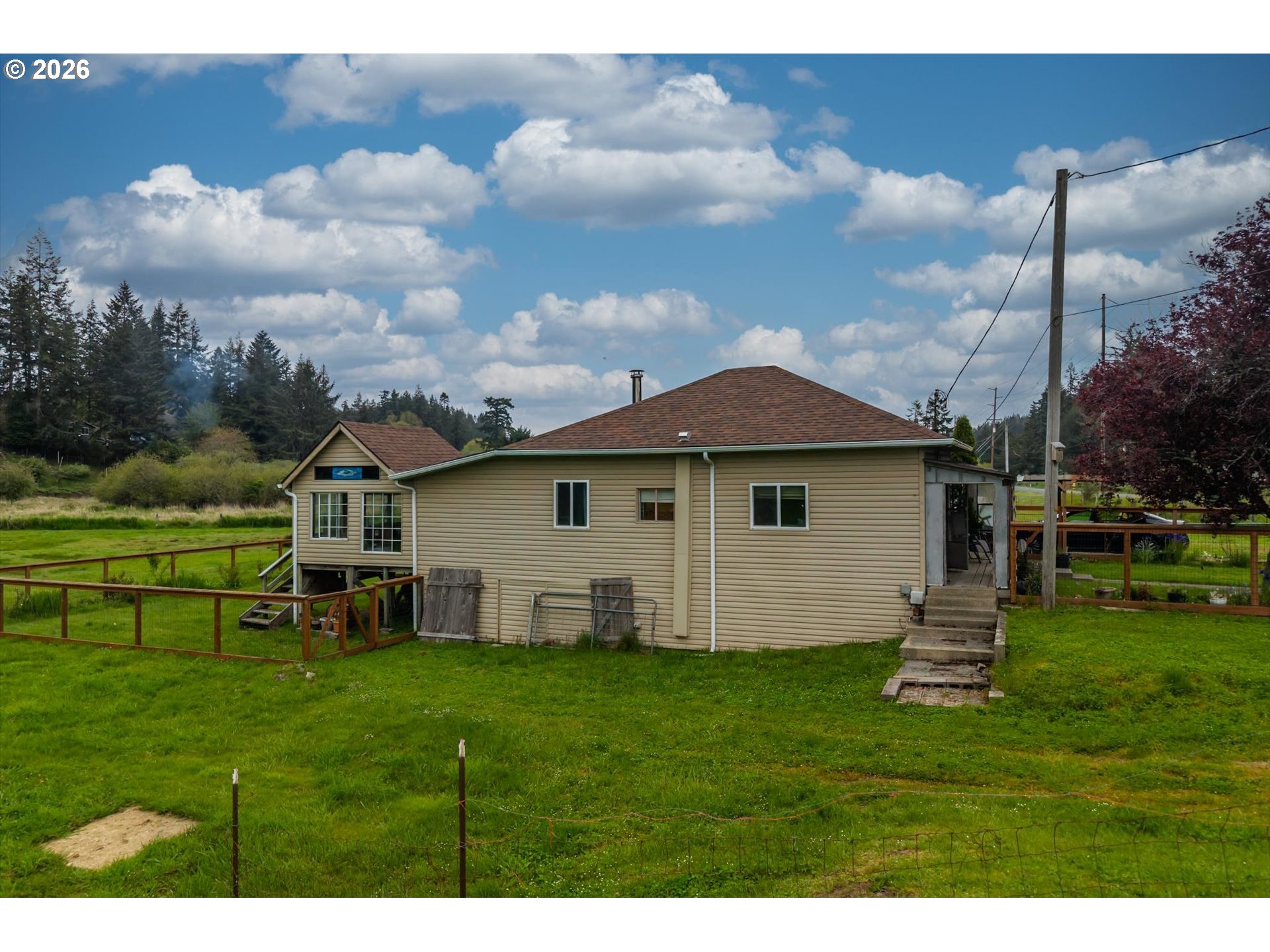 63008 Red Dyke Road Coos Bay, OR 97420 - Photo 5 of 18 a view of a house with a yard