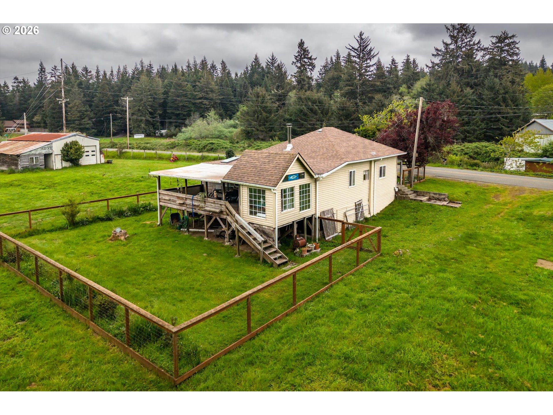 63008 Red Dyke Road Coos Bay, OR 97420 - Photo 6 of 18 a aerial view of a house with pool