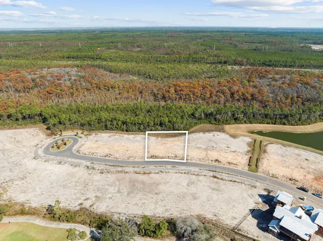 a view of a field with an ocean view