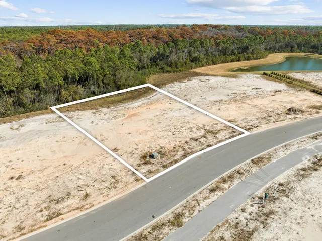 a view of a lake with a mountain and trees in the background