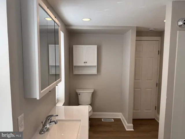 a bathroom with a sink and a window