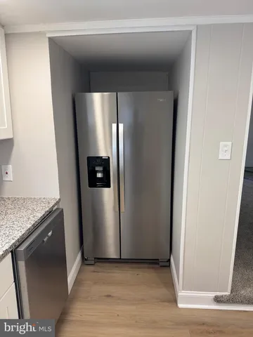 a view of a refrigerator in kitchen