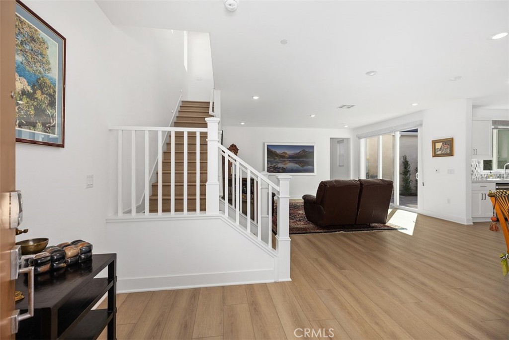 218 Sora Irvine, CA 92618 - Photo 13 of 65 a living room with furniture wooden floor and a flat screen tv