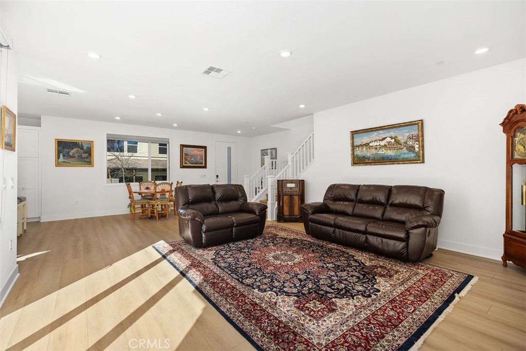 218 Sora Irvine, CA 92618 - Photo 16 of 65 a living room with furniture and a rug