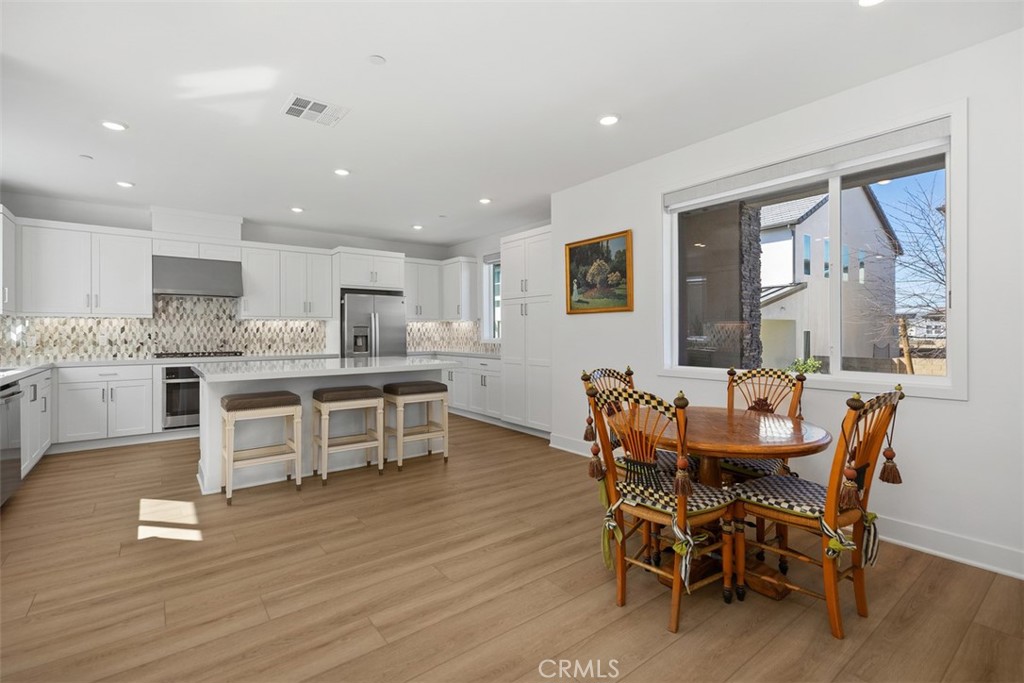 218 Sora Irvine, CA 92618 - Photo 22 of 65 a dining room with furniture and wooden floor