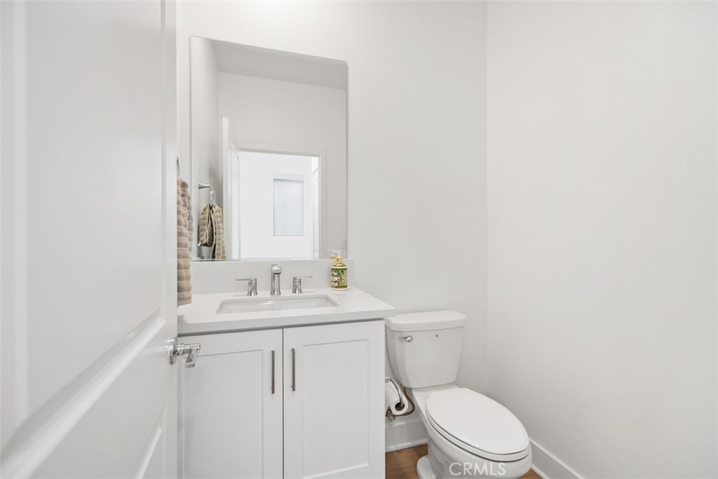 218 Sora Irvine, CA 92618 - Photo 29 of 65 a bathroom with a toilet a sink and mirror