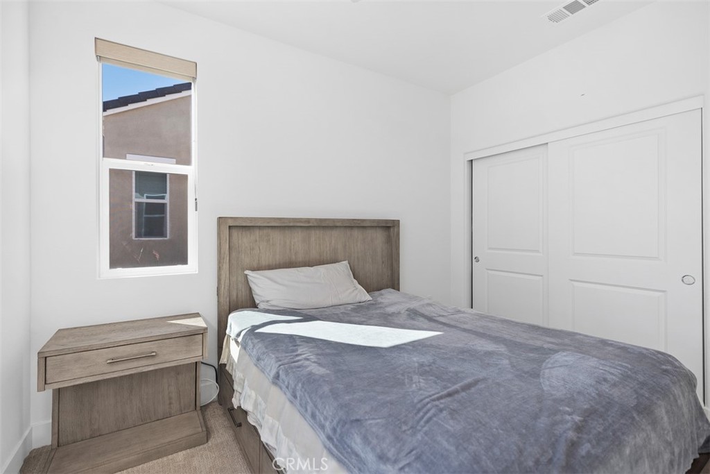 218 Sora Irvine, CA 92618 - Photo 31 of 65 a bedroom with a bed and a window