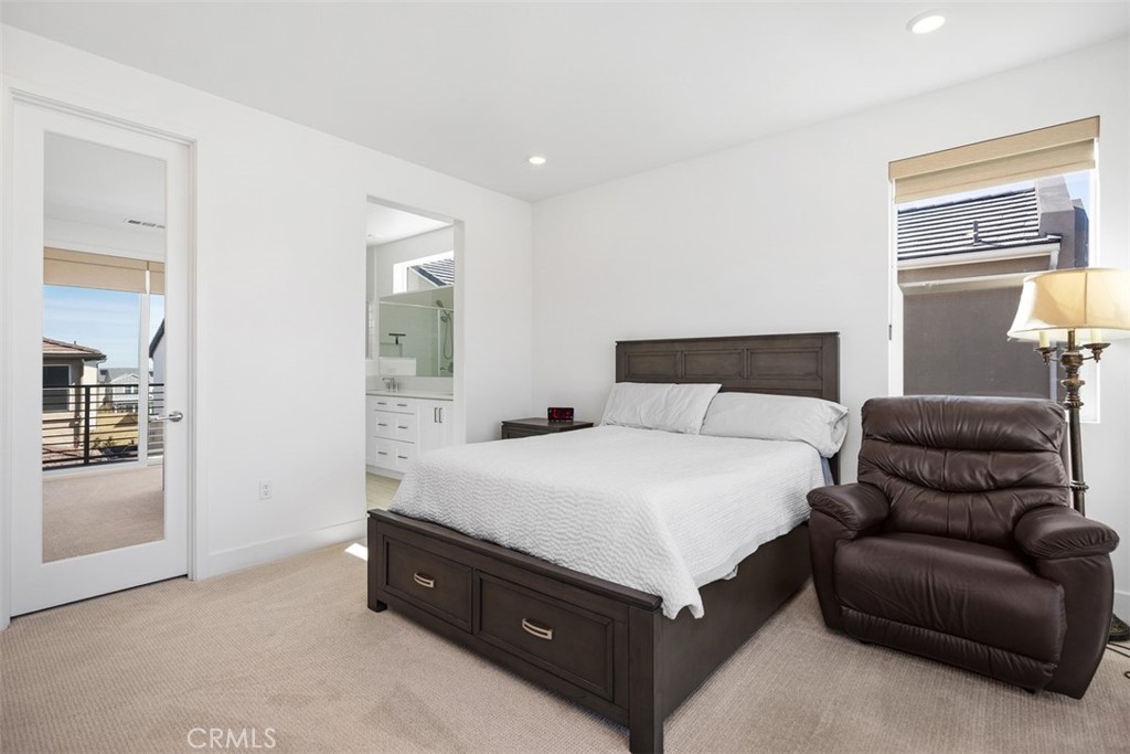 218 Sora Irvine, CA 92618 - Photo 39 of 65 a spacious bedroom with a bed and window