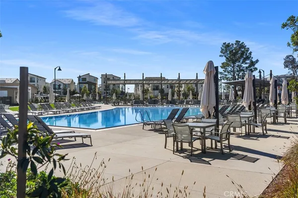 a view of a green field with some trees