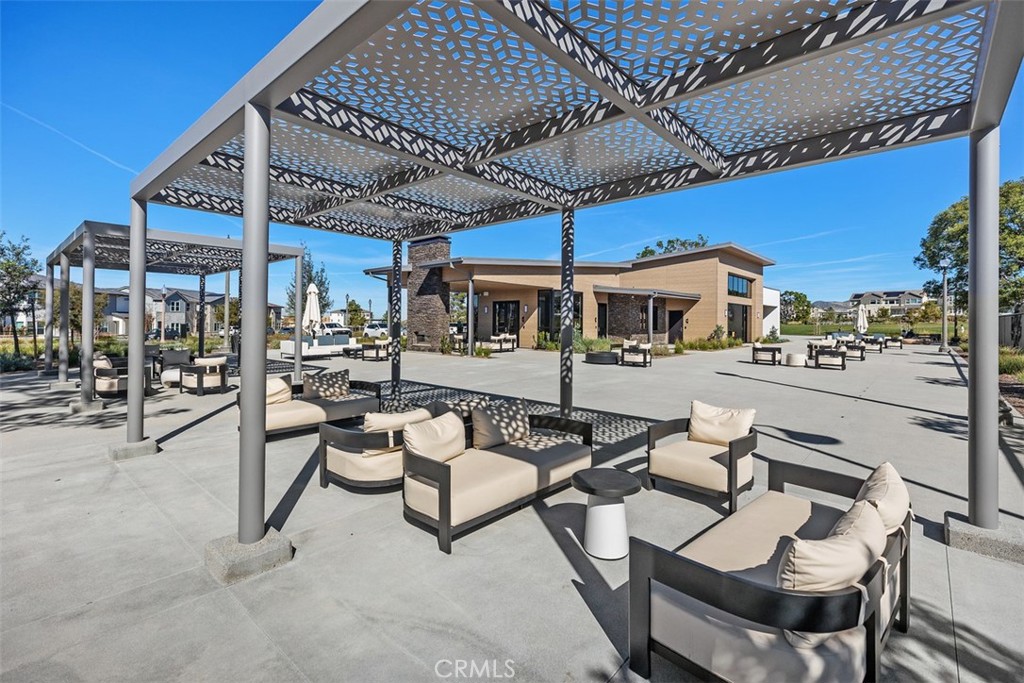 218 Sora Irvine, CA 92618 - Photo 52 of 65 a view of a patio with a table and chairs