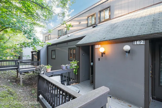 a view of house with outdoor seating space