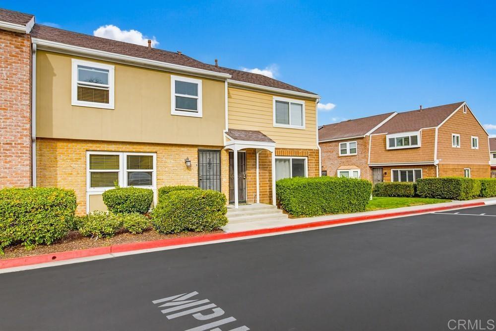 7861 Rancho Fanita Drive, Unit B Santee, CA 92071 - Photo 2 of 47 a front view of a house with garage and plants