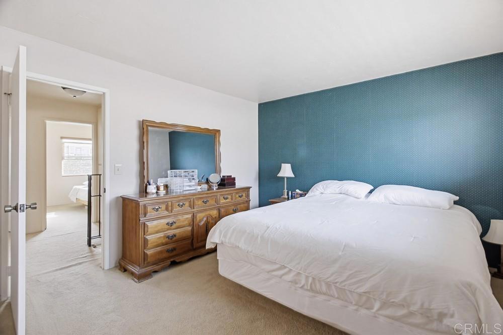 7861 Rancho Fanita Drive, Unit B Santee, CA 92071 - Photo 22 of 47 a bedroom with a bed and a flat screen tv