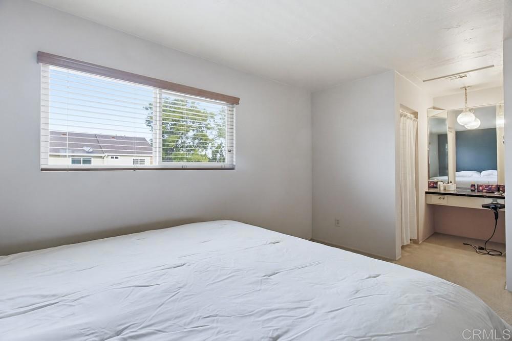 7861 Rancho Fanita Drive, Unit B Santee, CA 92071 - Photo 23 of 47 a bedroom with a bed and a window
