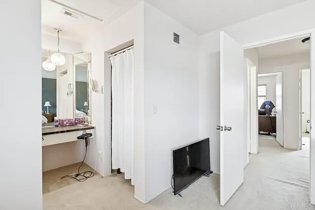 a view of a bathroom with a sink and mirror