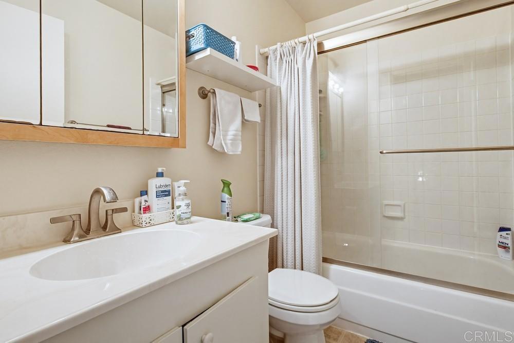 7861 Rancho Fanita Drive, Unit B Santee, CA 92071 - Photo 26 of 47 a bathroom with a sink a toilet and a mirror