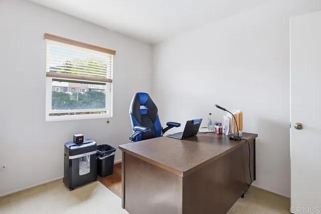 a view of a workspace with furniture