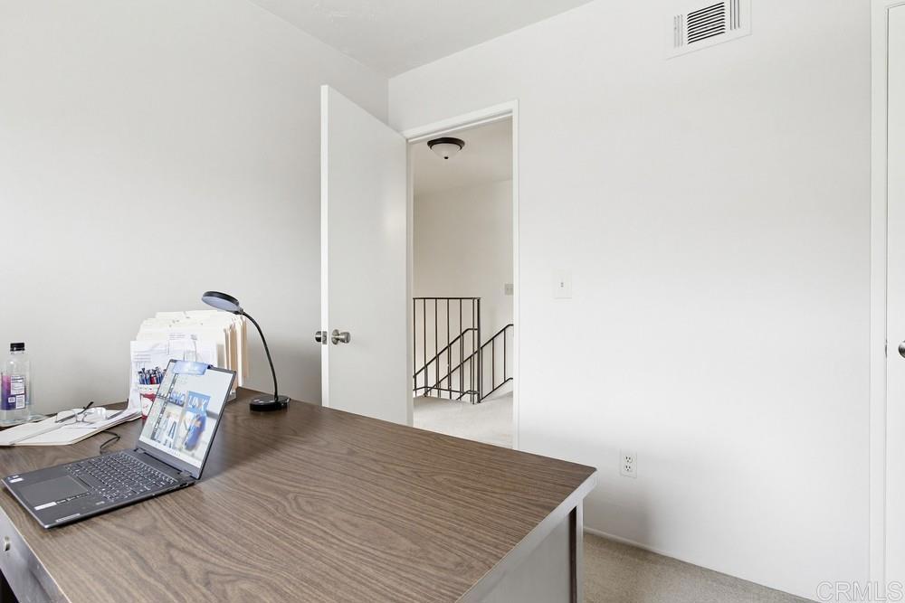 7861 Rancho Fanita Drive, Unit B Santee, CA 92071 - Photo 30 of 47 a bedroom with a bed and wooden floor