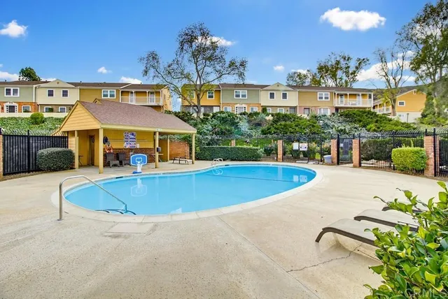 a view of a swimming pool with a patio