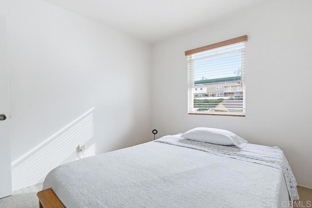 7861 Rancho Fanita Drive, Unit B Santee, CA 92071 - Photo 47 of 47 a bedroom with a bed and a window