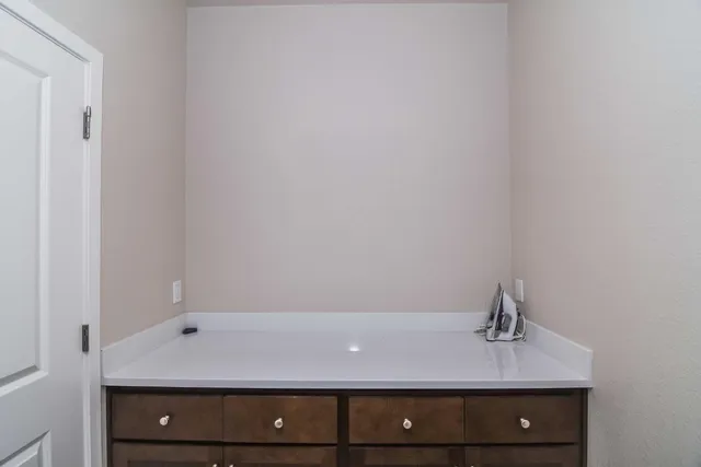 a bedroom with a bed and a ceiling fan