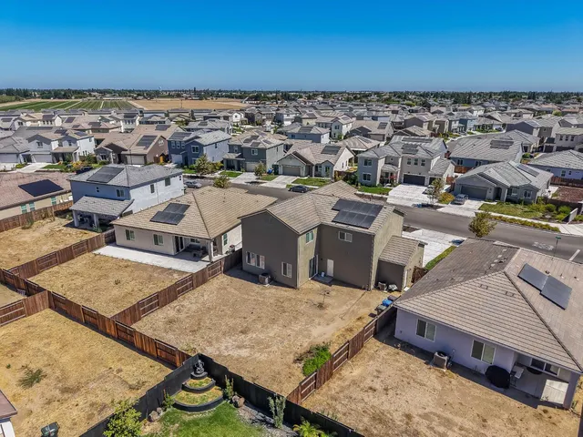 an aerial view of a house with a garden