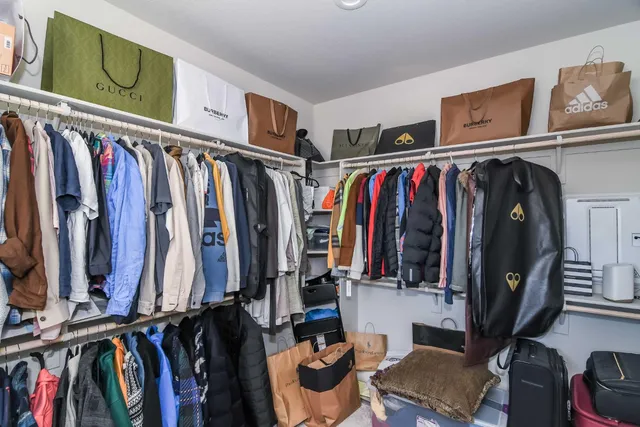 a view of a house with a wooden fence