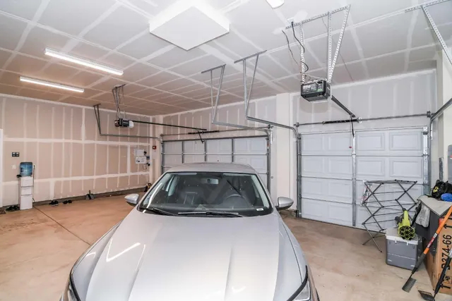a view of a field with grass and a houses