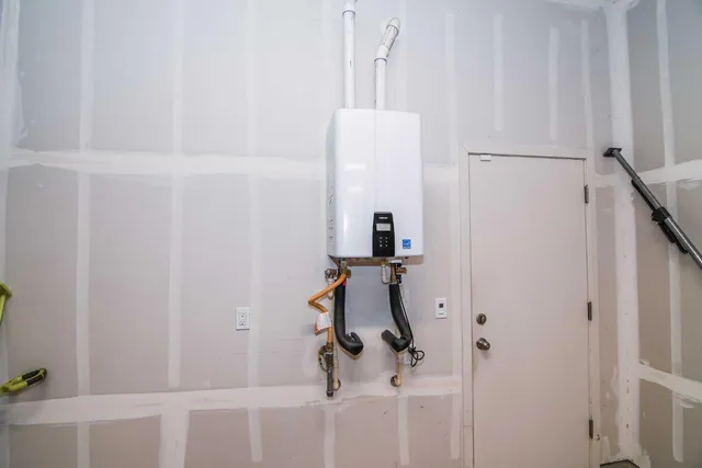 an aerial view of residential building and lake