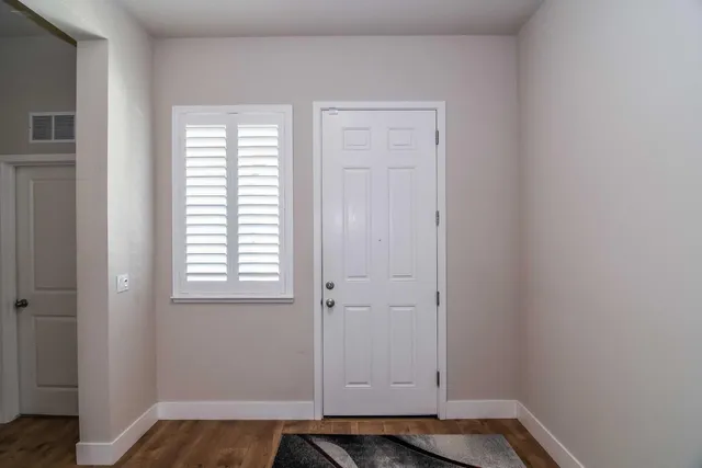 a work room with furniture and wooden floor
