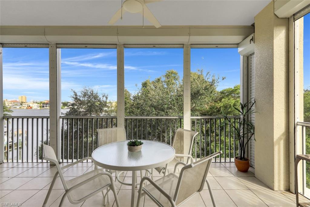 a view of a balcony with a table and chairs