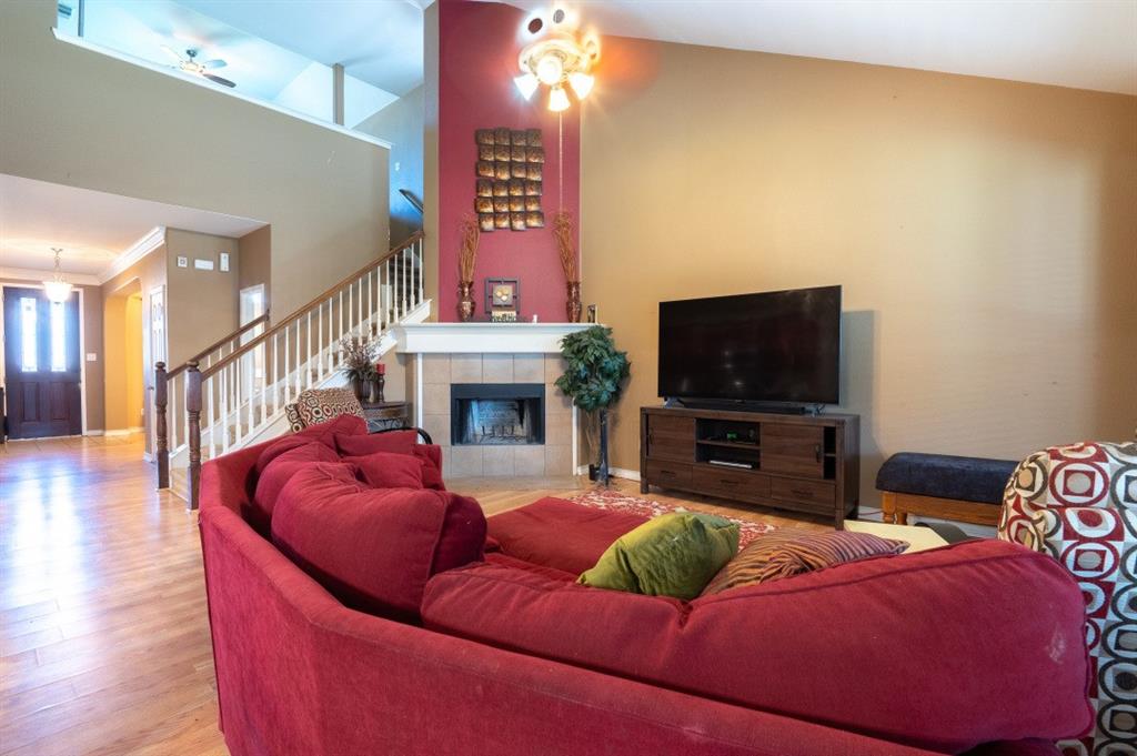 2248 Condor Street Grand Prairie, TX 75052 - Photo 18 of 25 a living room with furniture and a flat screen tv