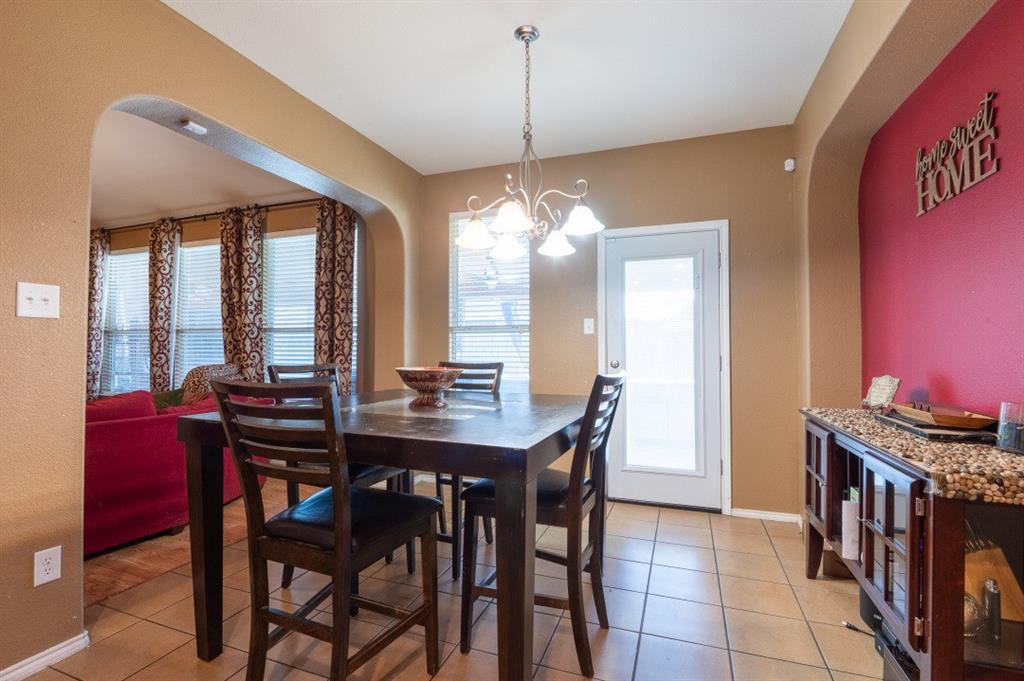 2248 Condor Street Grand Prairie, TX 75052 - Photo 23 of 25 a view of a dining room with furniture and window