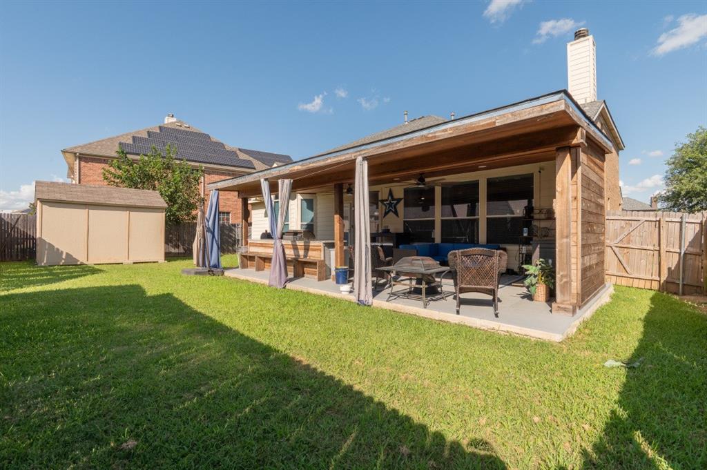 2248 Condor Street Grand Prairie, TX 75052 - Photo 25 of 25 a view of a house with backyard porch and sitting area