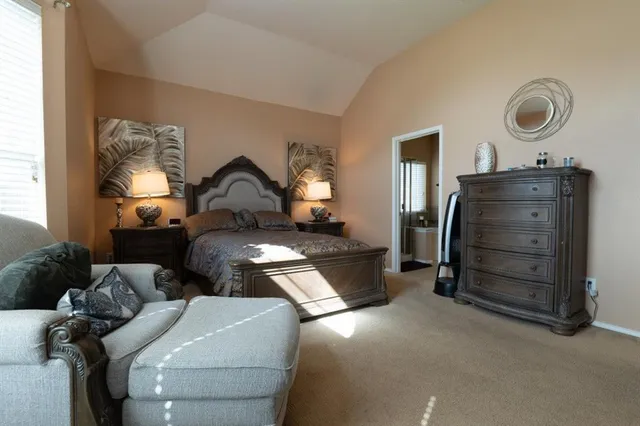 a living room with furniture and a mirror