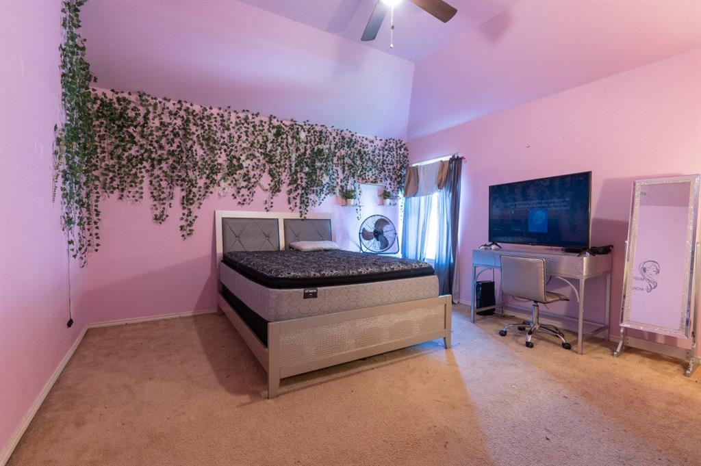 2248 Condor Street Grand Prairie, TX 75052 - Photo 7 of 25 a living room with furniture and a flat screen tv