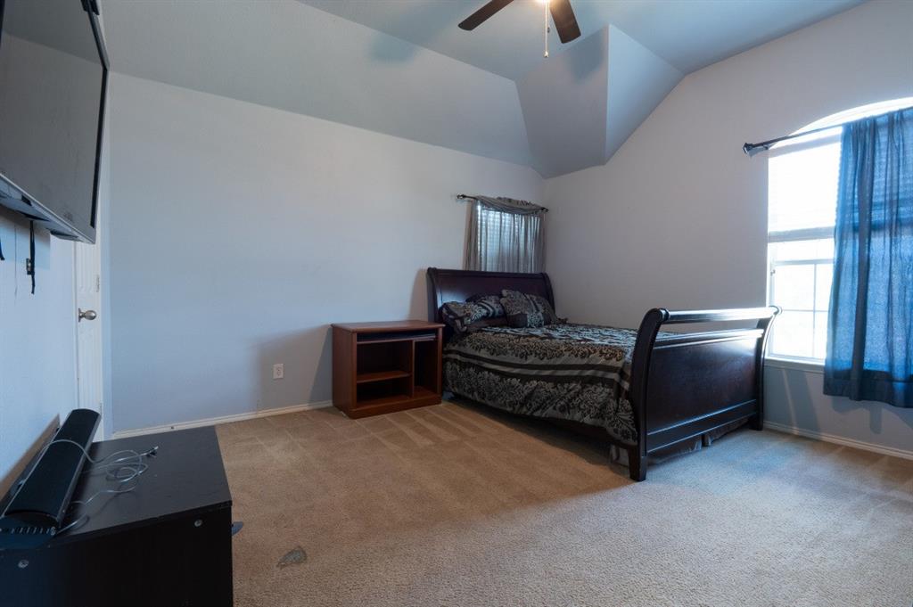 2248 Condor Street Grand Prairie, TX 75052 - Photo 8 of 25 a bedroom with furniture and a window