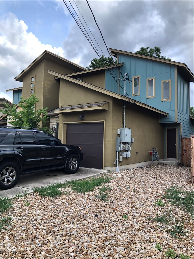 a view of a car in front of a house
