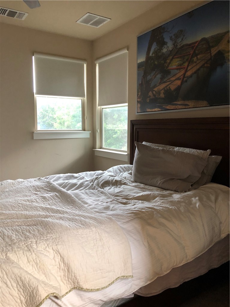 1303 Casey Street, Unit A Austin, TX 78745 - Photo 14 of 16 a bedroom with a bed and window
