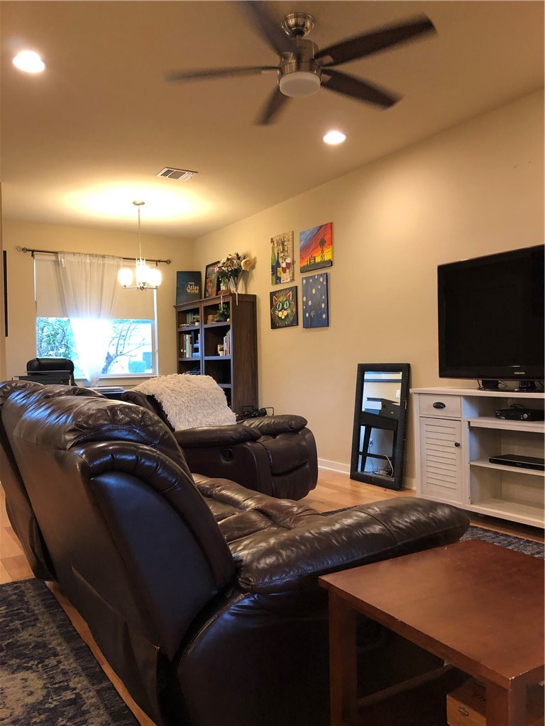1303 Casey Street, Unit A Austin, TX 78745 - Photo 5 of 16 a bedroom with a bed and a flat screen tv