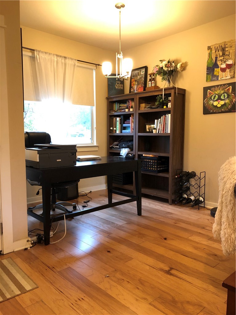 1303 Casey Street, Unit A Austin, TX 78745 - Photo 7 of 16 a view of a workspace with furniture and a window