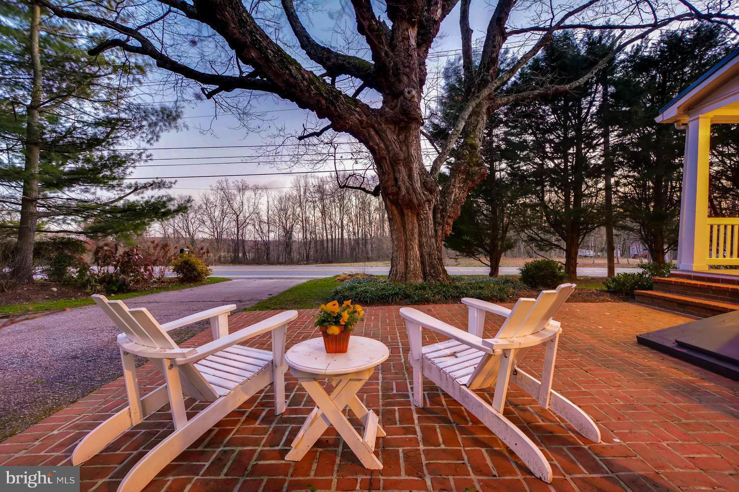 1034 Monkton Road Monkton, MD 21111 - Photo 27 of 30 a patio with a yard table and chairs