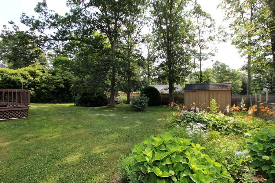 36 Edgewater Road Mashpee, MA 02649 - Photo 2 of 36 a backyard of a house with lots of green space