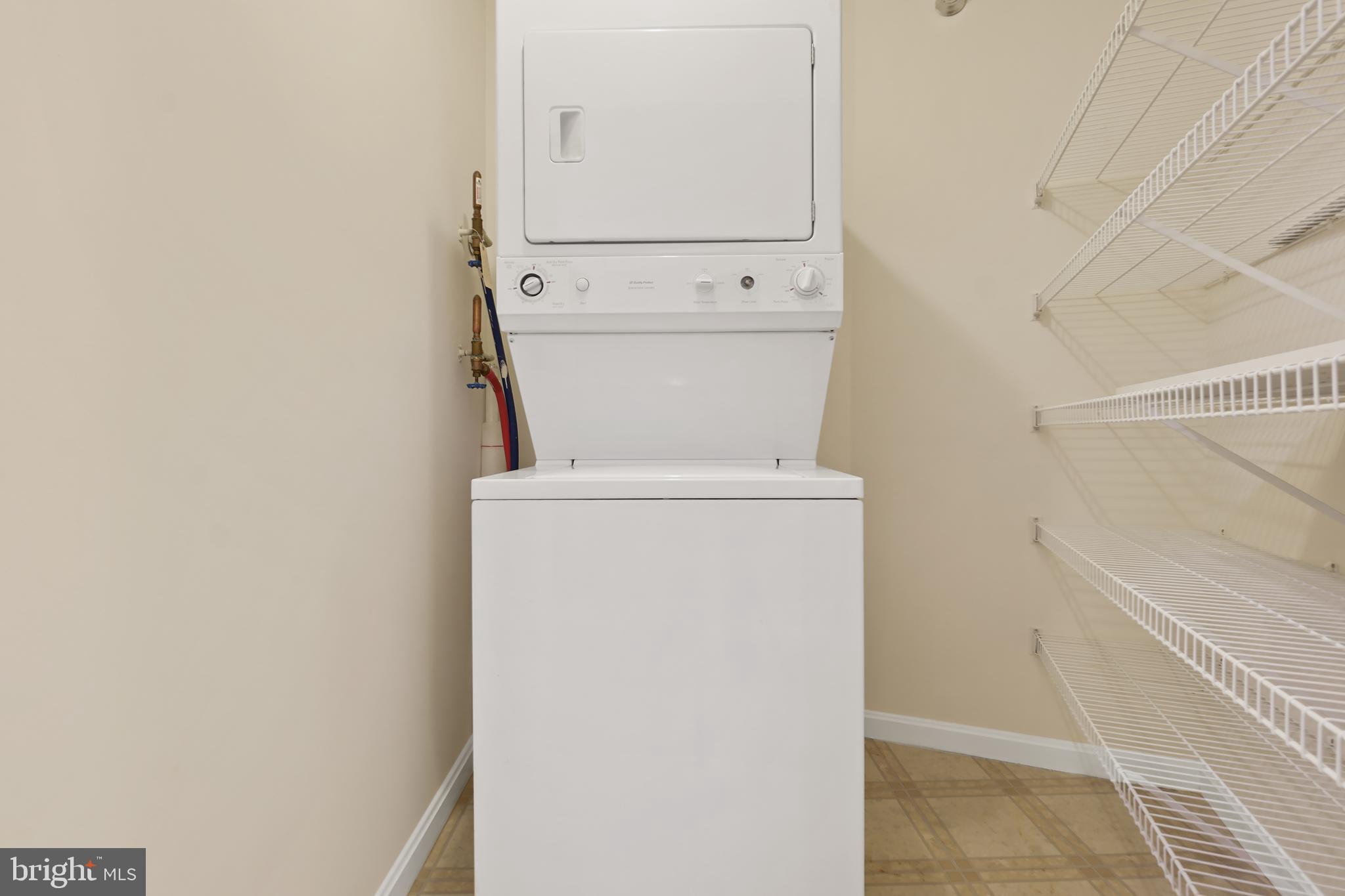 14801 Pennfield Circle, Unit 306 Silver Spring, MD 20906 - Photo 25 of 45 a utility room with dryer and washer