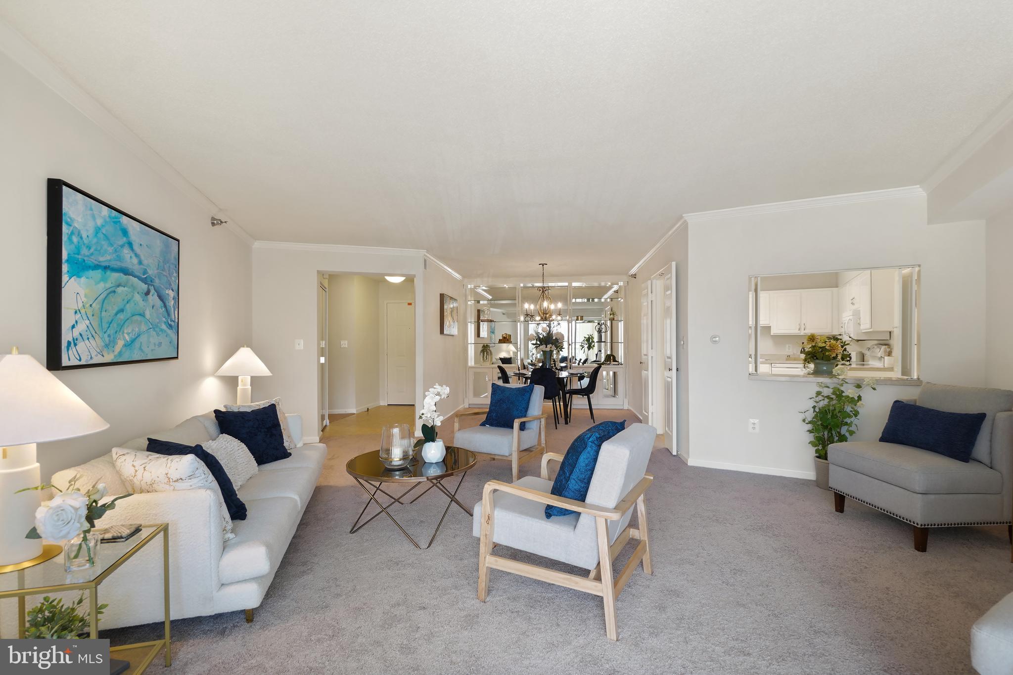 14801 Pennfield Circle, Unit 306 Silver Spring, MD 20906 - Photo 45 of 45 a living room with furniture and a chandelier