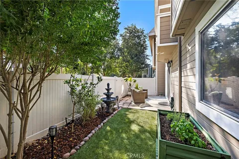 a view of yard with patio
