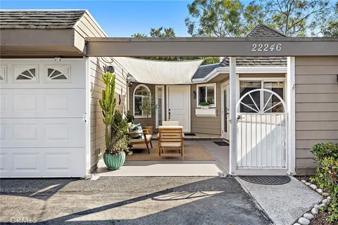a front view of a house with garage