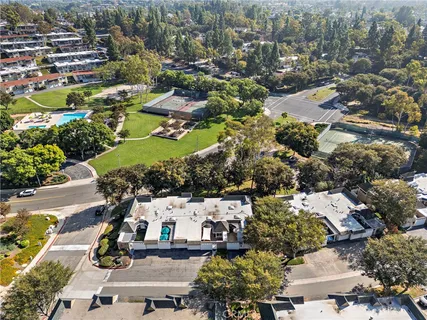 an aerial view of residential houses with outdoor space